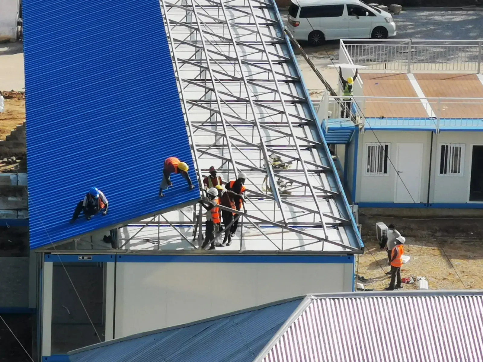 Light-gauge steel roof framing being installed on a modular building