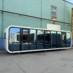 A60 apple cabin with an extended white enclosure and panoramic front glazing