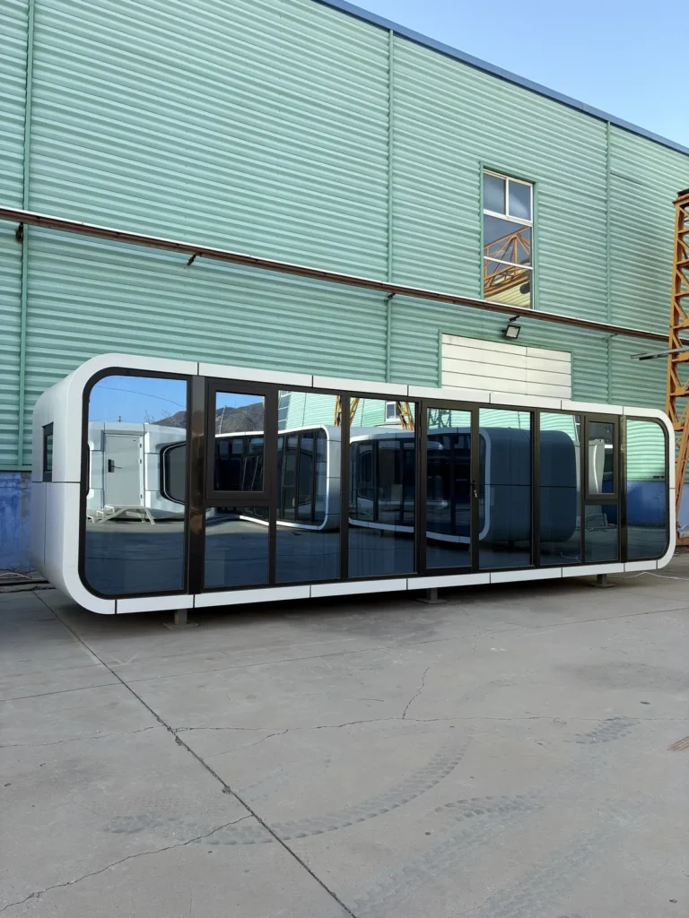 A60 apple cabin with an extended white enclosure and panoramic front glazing
