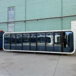 Front view of the A60 apple cabin outside the factory