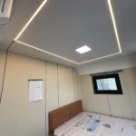Bedroom in the A60 apple cabin with perimeter ceiling lighting