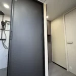 A60 apple cabin bathroom entrance and shower area