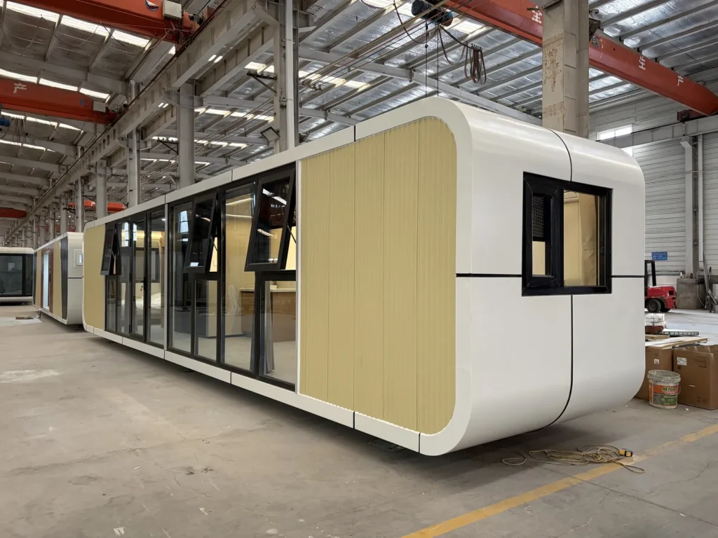 A70 apple cabin with yellow ribbed panels and a long black-framed glass frontage