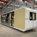 A70 apple cabin with yellow ribbed panels and a long black-framed glass frontage