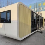 A70 yellow apple cabin displayed outdoors with a side window and glazed entrance