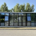 Front elevation of the park apple cabin with full-height glass doors and windows