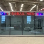 Front view of the service booth apple cabin with an electronic sign above the glazing