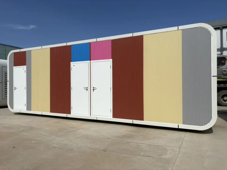 Apple cabin shower facilities with several entrance doors and coloured exterior panels