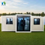 Front reference of a white expandable container house with a dark glazed entrance and windows on both wings
