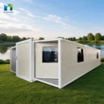 Rear and side reference of a white expandable container house with dark-framed windows