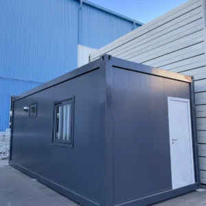 Grey flat pack staff rest cabin exterior