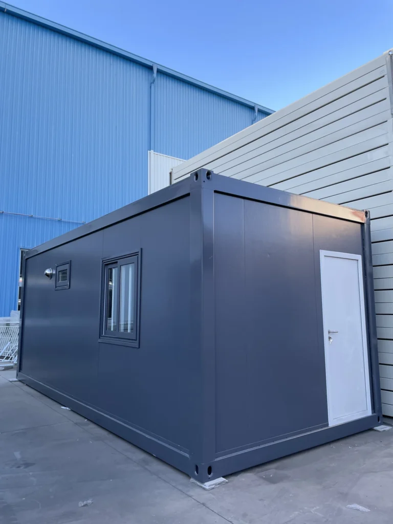 Grey flat pack staff rest cabin exterior