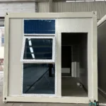Flat pack container suite with tall glazing beside the entrance