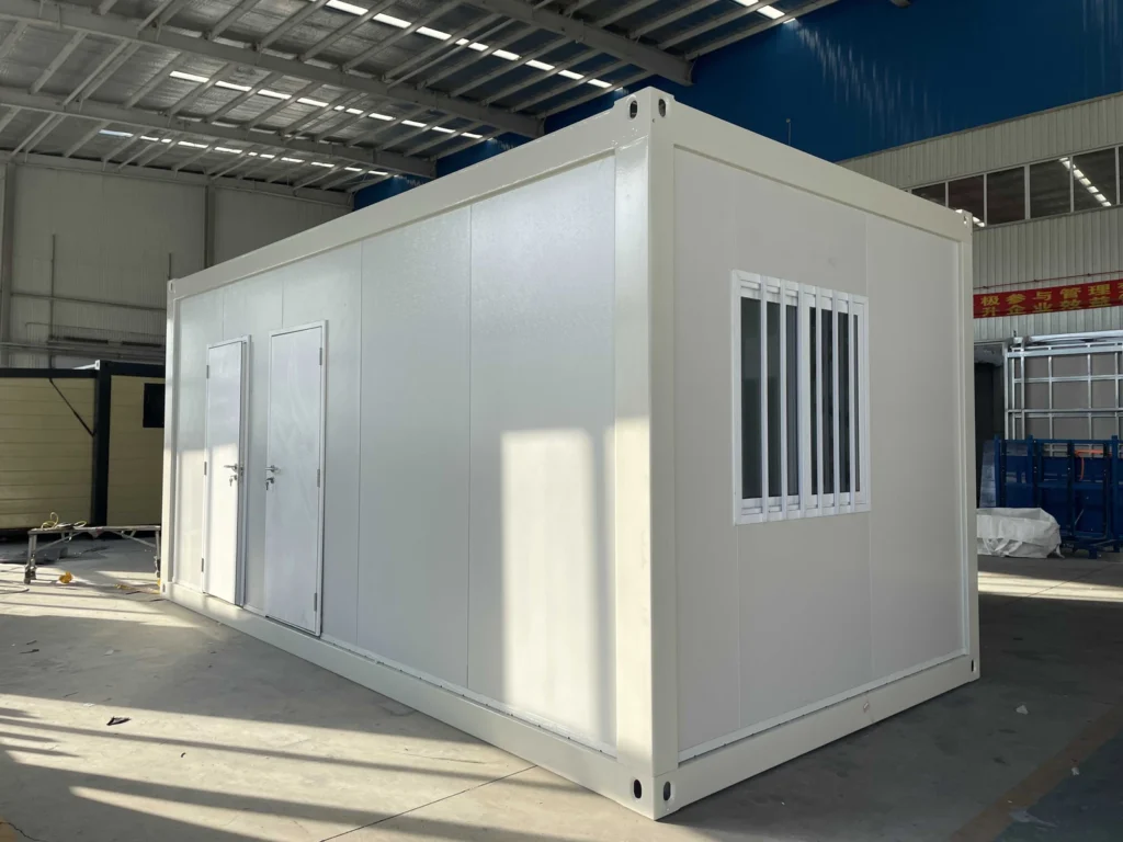 White flat pack toilet and shower unit with two entrance doors