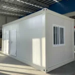 White flat pack toilet and shower unit with two entrance doors