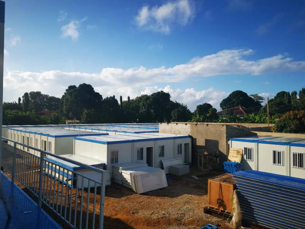 Single-storey modular accommodation rows in the Tanzania camp