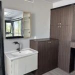 E30 interior vanity and wardrobe arrangement beside the bathroom area