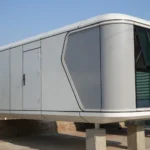 Alternate G60S exterior view showing white wall panels, grey trim and end glazing