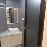 Vanity and bathroom doorway in the panoramic capsule configuration