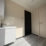 Vanity and doorway arrangement in the two-room capsule interior