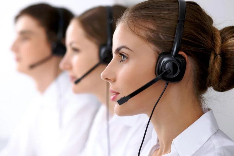 Customer support representatives wearing headsets
